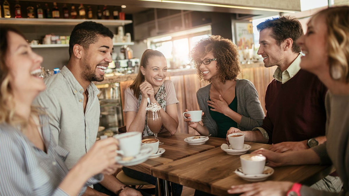 Aroma Expeditions - Group of People Enjoying Coffee Together at a Cafe