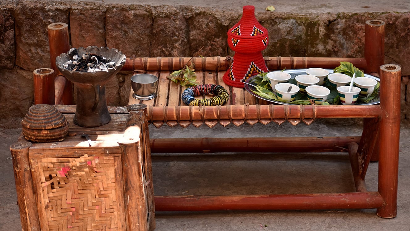 Traditional Ethiopian Coffee Ceremony Setup with Coffee Cups and Roasting Tools