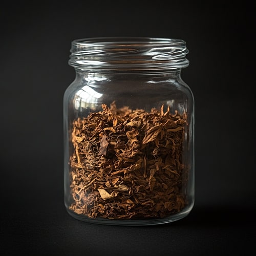 Coffee Aroma and Taste — Earthy and Tobacco Notes in Coffee Jar Filled with Dried Tobacco Leaves