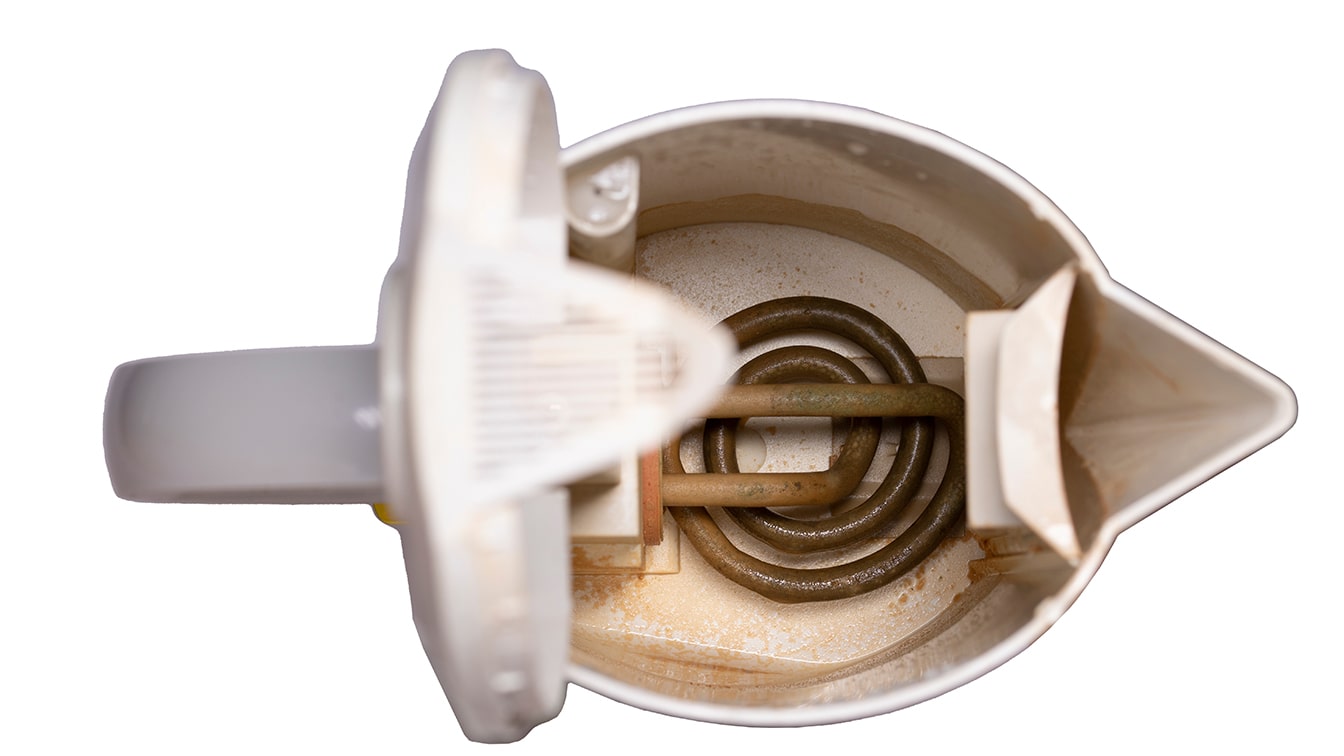 Coffee Gear Problems — Limescale in Electric Kettle Coffee Gear Problems — Inside View of an Electric Kettle Showing Mineral Buildup