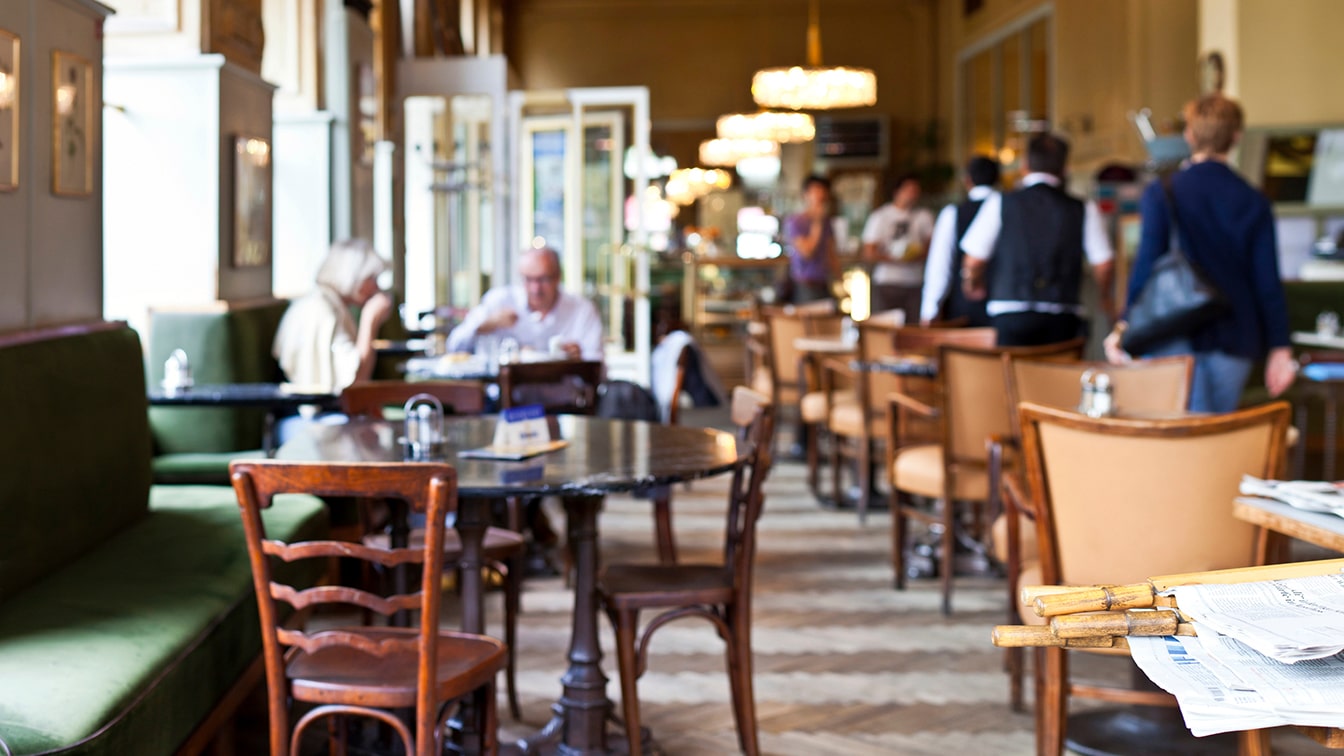 Vienna Coffee House Culture — A Classic Viennese Cafe with Wooden Chairs, Marble Tables, and a Warm, Inviting Ambiance